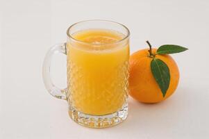 Fresh Orange Juice with Whole Citrus Fruit photo