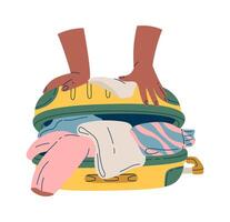 Open suitcase full of clothes flat icon Icon vector