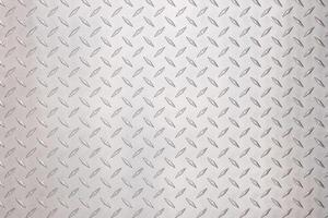 metallic steel plate with diamond pattern. light silver metal background photo