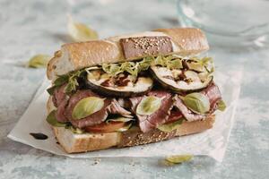 a gourmet sandwich with grilled eggplant photo