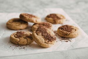 Chocolate chip cookies on parchment paper photo