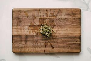 a well-worn acacia wood cutting board photo