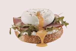 Poached egg on bagel with ham photo