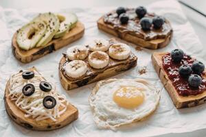 A photograph showcasing five variations of sweet potato toast photo