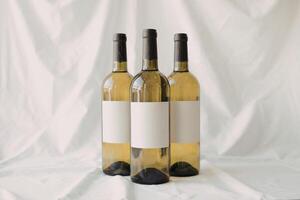 three empty wine bottles photo
