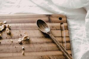 A photograph of a well-worn acacia wood cutting board photo