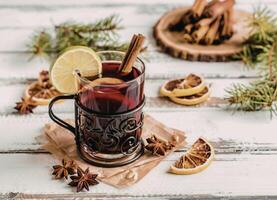 Spiced drink with lemon and cinnamon photo