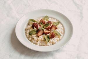 A photograph of a bowl of creamy apple porridge photo