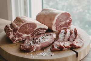 A photograph of a selection of expertly cut raw meats photo