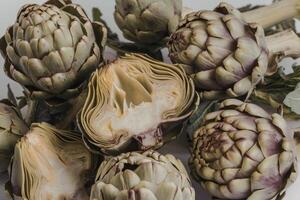 A photo of a vibrant setting with fresh artichokes