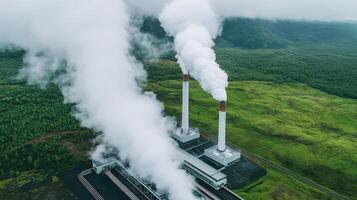 Industrial power plant surrounded by lush greenery and emitting smoke. Renewable resources geothermal and sustainability efficiency concept. photo