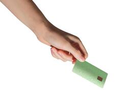 Cashless payment concept. Hand holding modern plastic card with chip for credit, debit, loan, photo