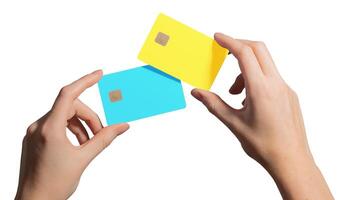 Bright finance concept. Hand holding two different plastic bankcards with chip for credit, debit, photo