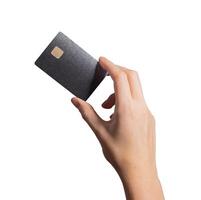 Black card trade concept. Hand holding smart plastic bankcard with chip in closeup for credit, debit photo