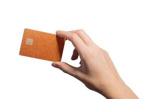 Retail store payment. Hand holding plastic bankcard with chip in closeup for credit, debit, cashback photo