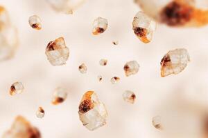 Flying stones calcite mineral on beige. Natural mineral rocks specimen. photo