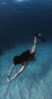 October 27, 2024. Bali, Indonesia. Freediver woman with video