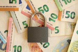 Euro banknotes with lock background photo