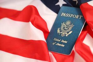 Latest version of United States of America citizen Passport on USA national flag photo