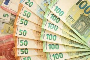 Pile of euro banknotes as finance background photo