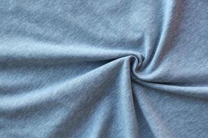 Gray Cotton natural fabric, weaving of threads texture, curl crumpled fold. photo