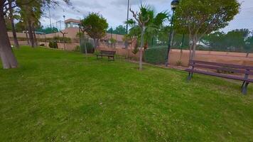 A park with benches and a tennis court video