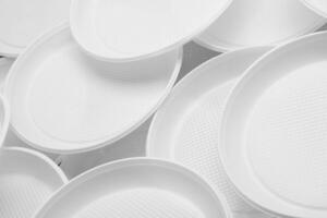 White plastic plates close-up photo