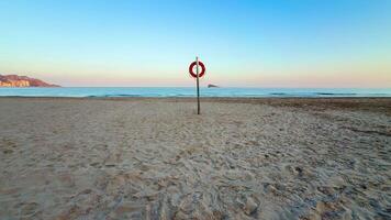 A red sign on a beach video