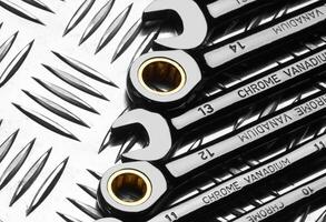 Set of wrenches on metal photo