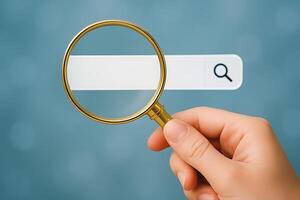 Hand holding magnifying glass over search bar image photo