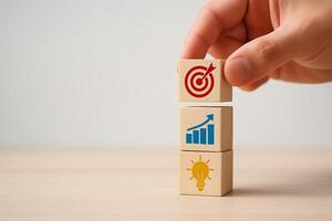 Hand stacking wooden cubes with business icons image photo