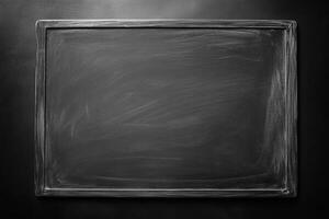 The grey chalkboard presents a blank surface ready for creative writing or drawing, perfect for classrooms or personal use photo
