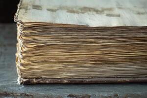Closeup view reveals the delicate texture and age of open book pages, highlighting their intricate details and worn charm in a serene setting photo