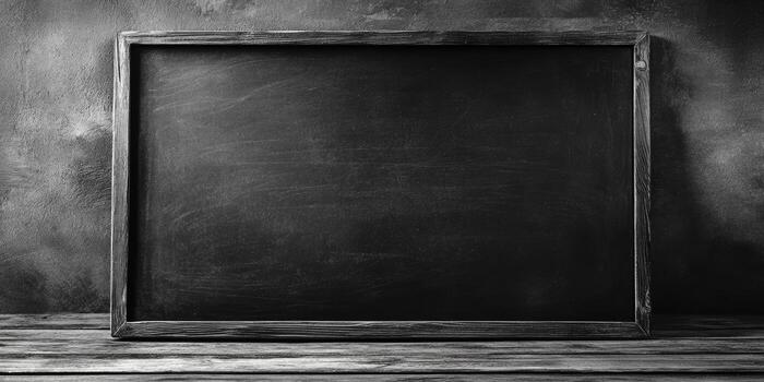 Dark chalkboard with a worn wooden frame stands against a textured background on a rustic wooden surface, perfect for creative writings photo