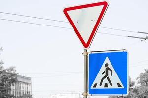 Road signs Pedestrian crossing and Give way on a street photo