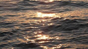 Ocean waves motion at sunset, slow motion video