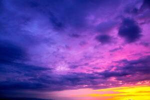 a purple sky with a purple and orange horizon and a purple cloud. Dramatic sky. Spectacular Sky at Sunset. photo