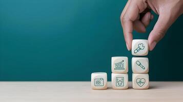 Hand holding dice with icons on them photo