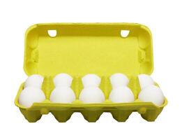 Cardboard egg box with eggs on white photo