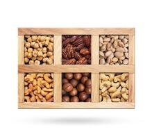 Set of a nuts in a wooden box on white photo