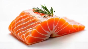 Fresh,raw salmon fillet isolated on a white background, garnished with a sprig of dill. Suitable for culinary, nutrition, and seafood industry contexts. photo