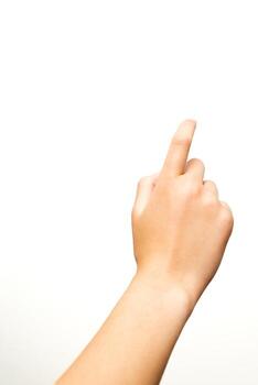 A single human hand with an extended index finger is isolated against a plain white background. Suitable for concepts involving direction, selection, touch, or interface in digital or educational contexts. photo