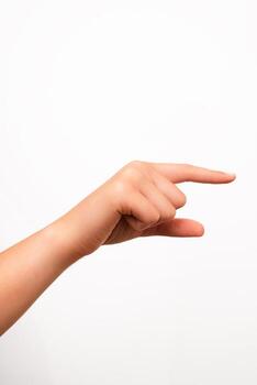 A left human hand with fingers extended in a pointing gesture is isolated on a plain white background. Suitable for concepts involving direction, instruction, or user interface design. photo