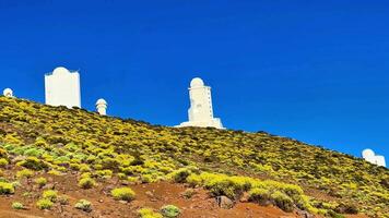 An absolutely spectacular and breathtaking view of astronomical observatories on rugged terrain photo