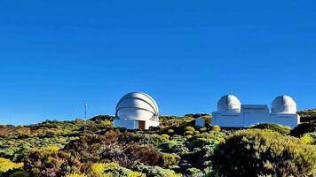 The Breathtaking and Stunning View of Astronomical Observatories Beneath a Clear Blue Sky photo