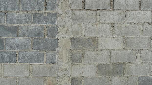 Brick blocks arranged in rows to build a wall. There is a concrete core to strengthen the structure. For background and textured. photo