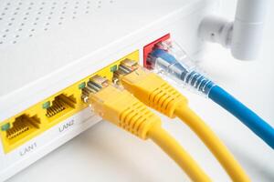 Ethernet cable with wireless router connect to internet service provider network. photo