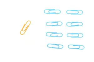 Contrasting Paper Clips on White Backdrop - A Visual Representation of Individuality photo