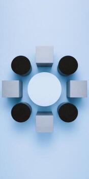 Abstract flat lay of geometric cylinders and shapes on blue background for modern design photo