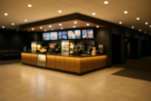 Blurred View of Cinematic Concession Stand with Illuminated Menu Displays and Warm Lighting in Modern Theater photo